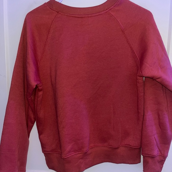Coral color med unisex crewneck polyester sweater with a swoosh check mark on it - Picture 5 of 7